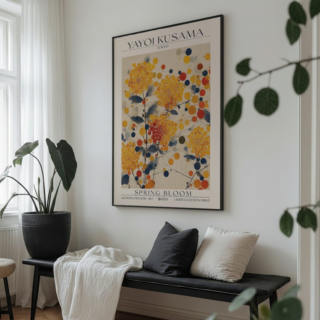 Framed Yayoi Kusama 'Spring Bloom' poster in a room with windows.