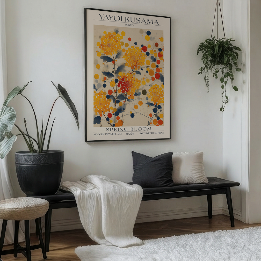 Framed Yayoi Kusama 'Spring Bloom' poster in a room with windows.