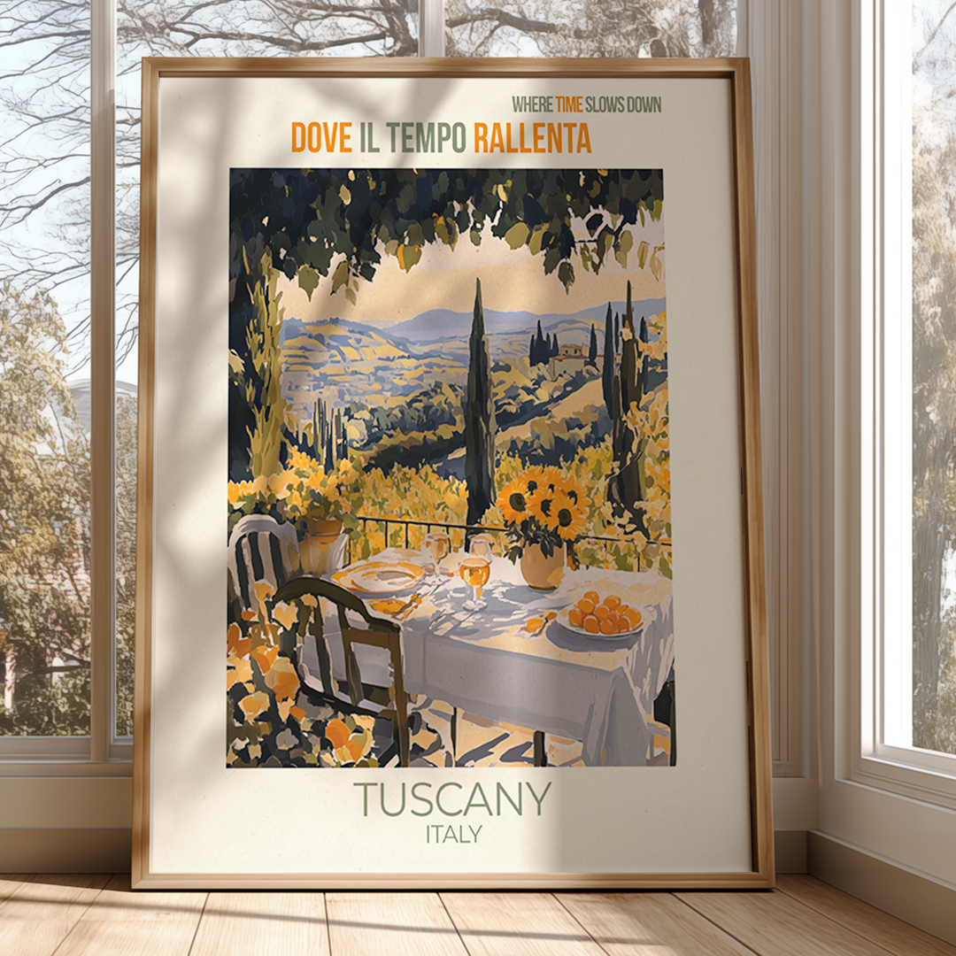 Framed artwork of a Tuscany scene with a table set for lunch, surrounded by windows.