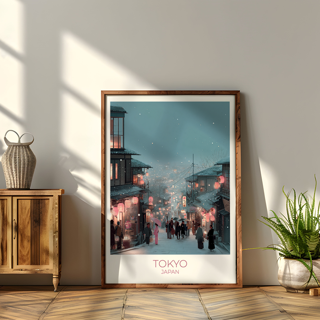 Framed artwork of a Tokyo street scene on a wall with wooden cabinet and plant.
