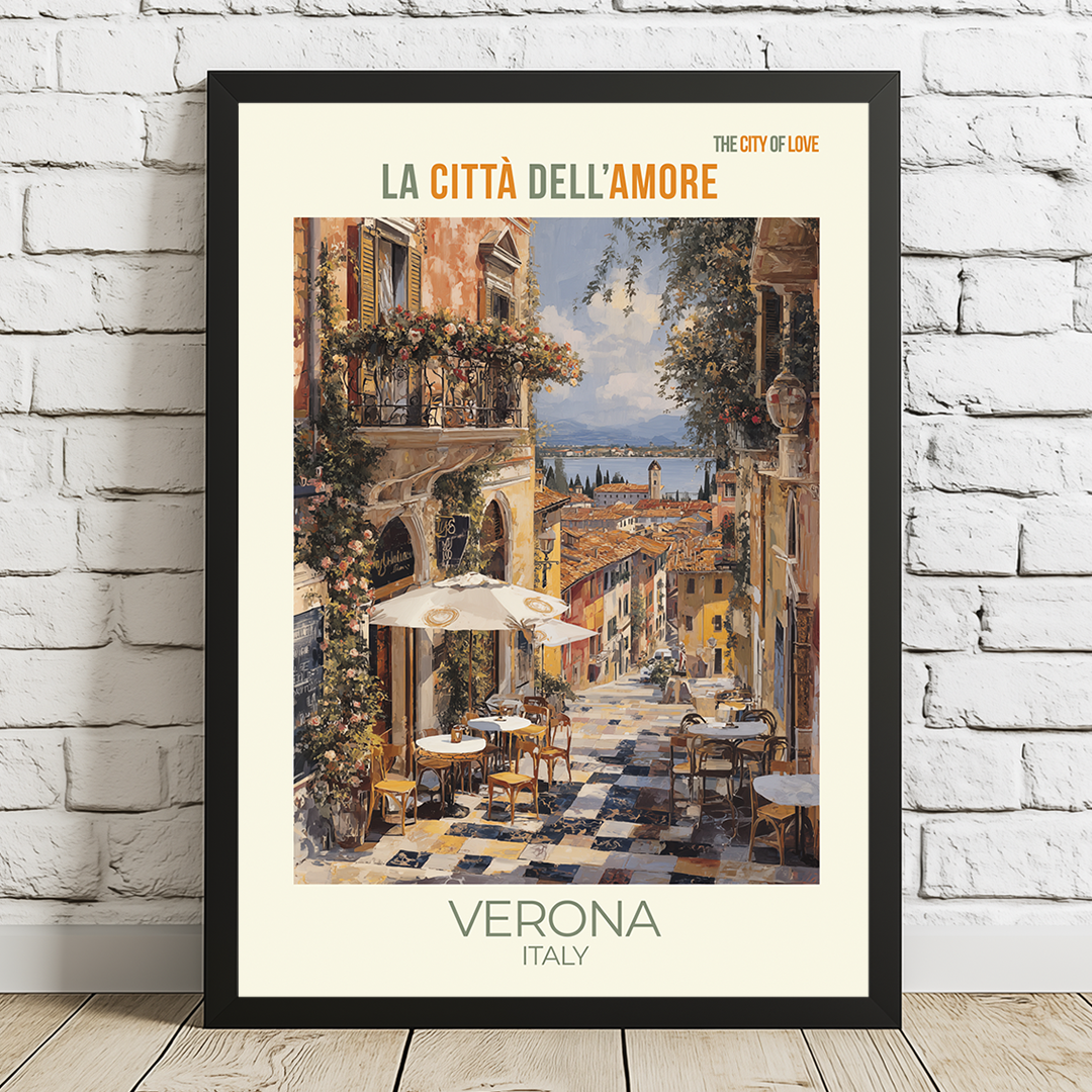 Framed artwork of a street scene in Verona, Italy, with text 'La Città dell'Amore' on a white brick wall.
